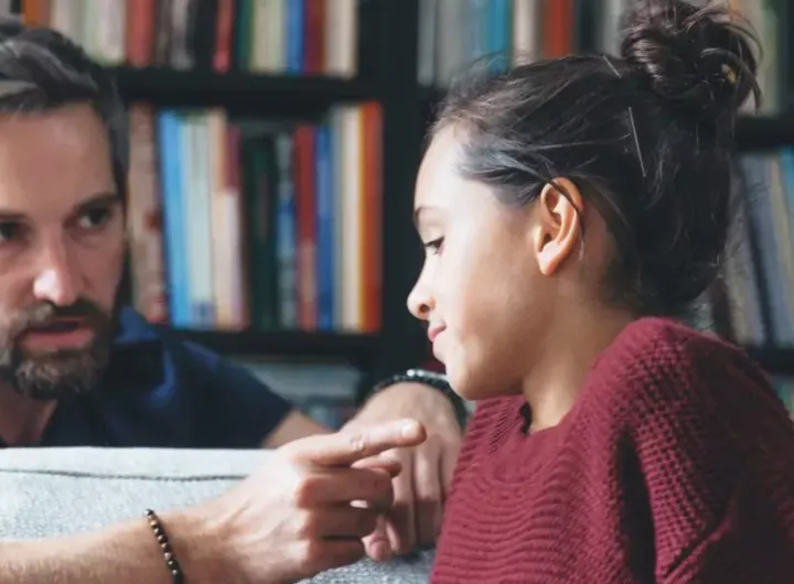 father and young teen daughter intense conversation